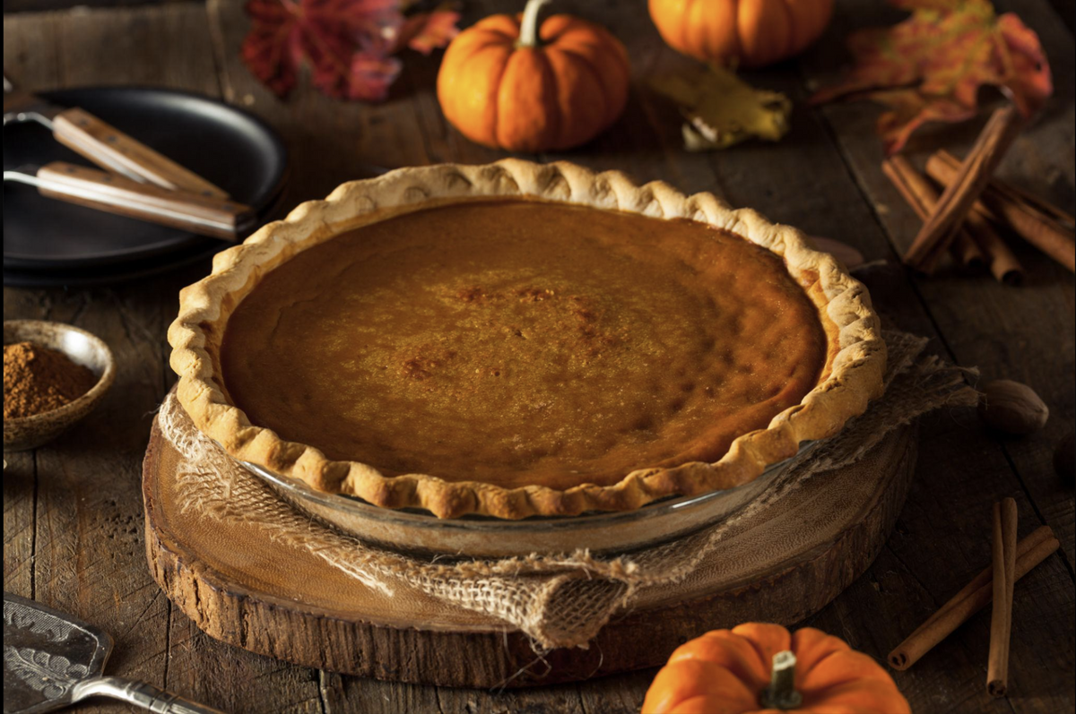 Pumpkin pie in a rustic autumn setting